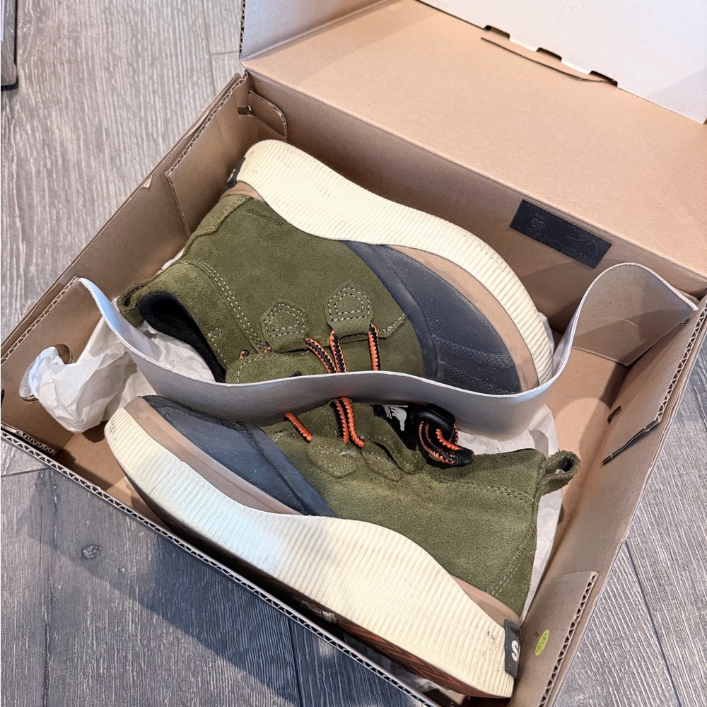 Sorel waterproof boots in utility green / black.